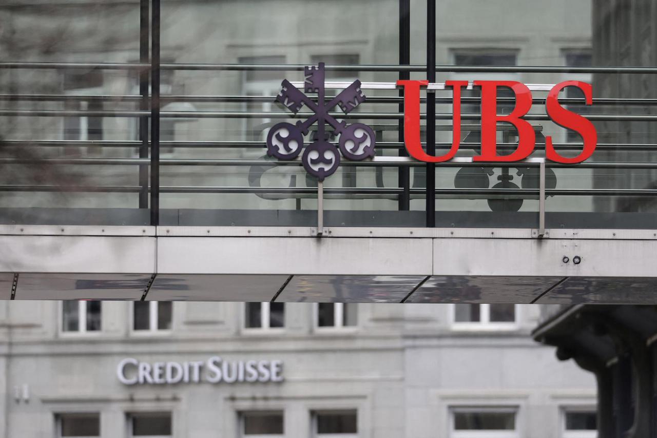 Logos of UBS and Credit Suisse banks are seen in Zurich