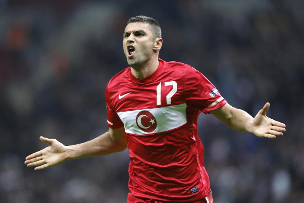 \'Turkey\'s Burak Yilmaz celebrates after scoring a goal against Azerbaijan during their Euro 2012 qualifying Group A soccer match at Turk Telekom Arena in Istanbul October 11, 2011. REUTERS/Murad Sez