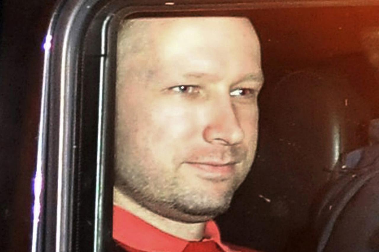 \'Norwegian Anders Behring Breivik, the man accused of a killing spree and bomb attack in Norway, sits in the rear of a vehicle as he is transported in a police convoy as he is leaving the courthouse 