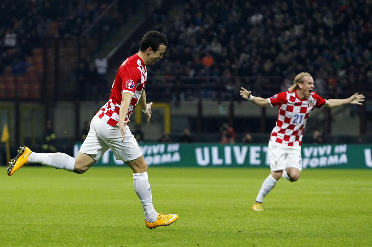 Croatia's Ivan Perisic (L) celebrates after scoring against Italy during their Euro 2016 qualifying soccer match at the San Siro stadium in Milan November 16, 2014.  REUTERS/Alessandro Garofalo (ITALY - Tags: SPORT SOCCER)