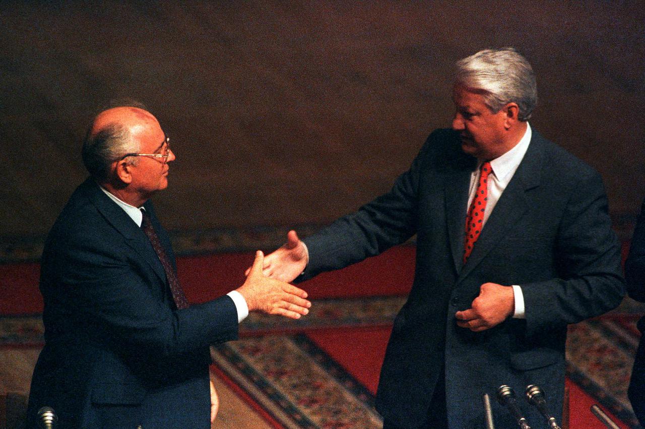 FILE PHOTO: Soviet President Gorbachev shakes hands with Russian President Yeltsin in Russian Parliament
