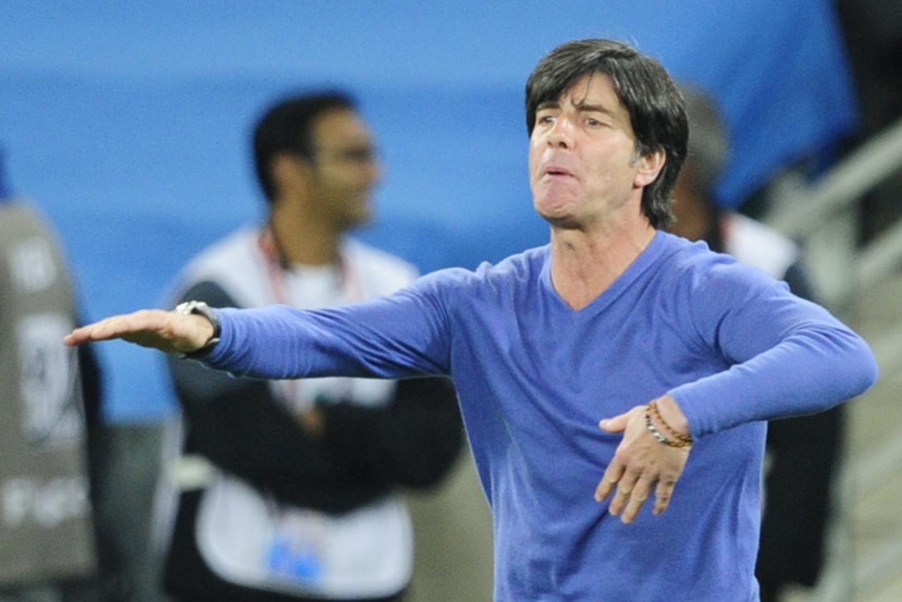 'Germany\'s coach Joachim Loew reacts during the 2010 World Cup semi final Germany vs Spain on July 7, 2010 at the Moses Mabhida stadium in Durban. NO PUSH TO MOBILE / MOBILE USE SOLELY WITHIN EDITORI