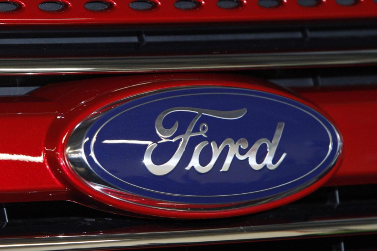 \'A Ford logo is seen on a 2011 Ford Explorer at the Ford assembly plant in Chicago, Illinois, December 1, 2010. Ford Motor Co said its U.S. sales rose 24 percent in November from a year earlier amid 