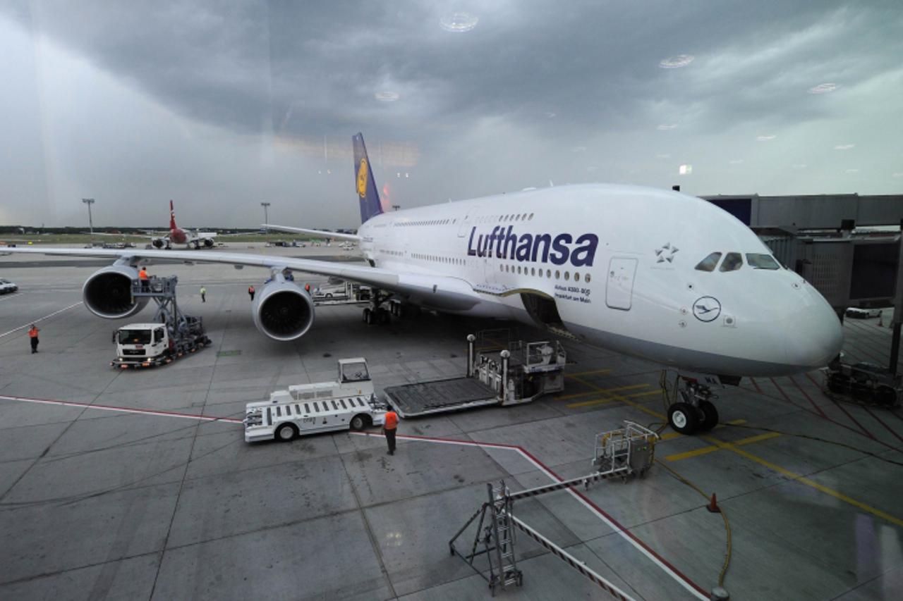 'FILES - Picture taken on June 6, 2010 shows a Lufthansa Airbus A-380 aircraft waiting for passengers at Frankfurt airport. The leading German airline, Lufthansa, said on January 12, 2011 that its pas