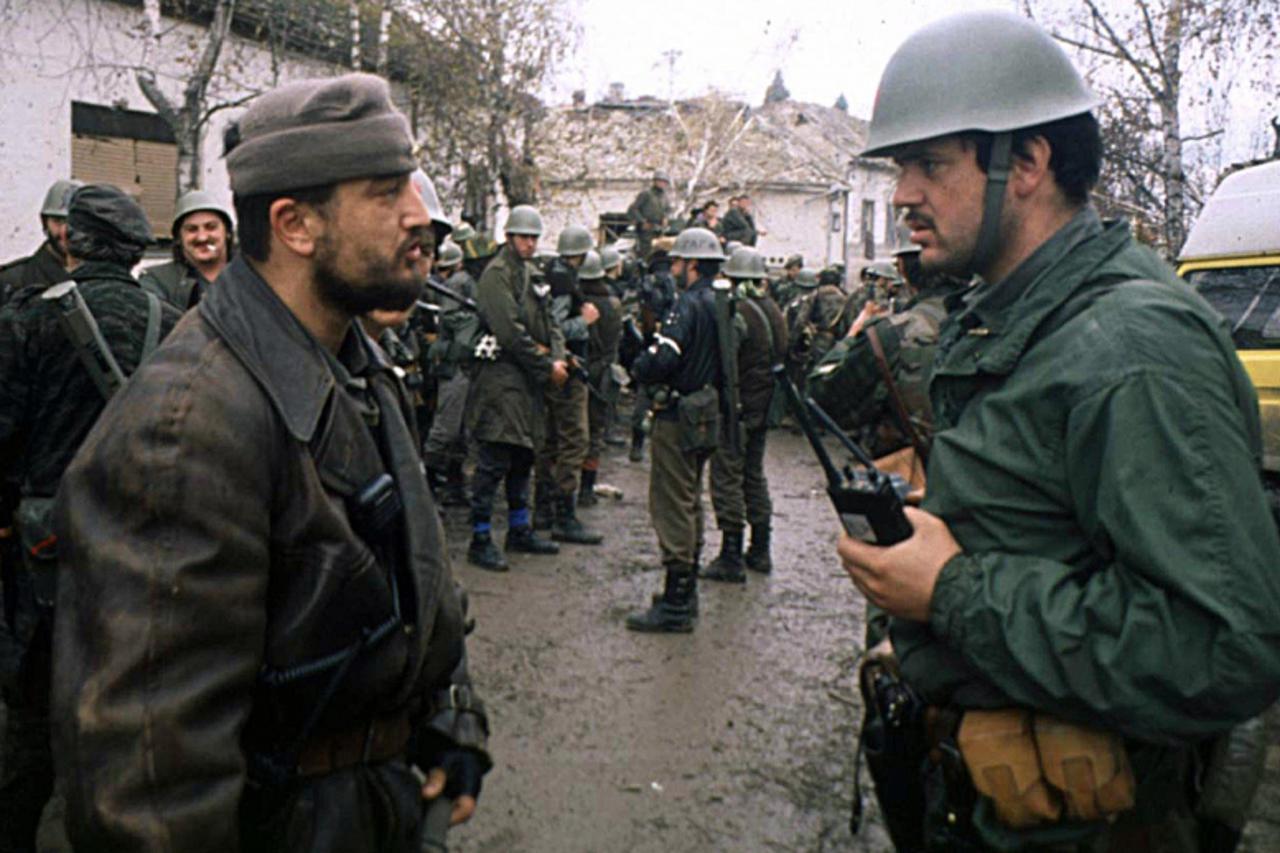 'This picture taken in November 1991 in the Croatian town of Vukovar shows Yugoslav army captain Miroslav Radic (R) listening to a report of a Serbian paramilitary. Beta news agency reported 21 April 