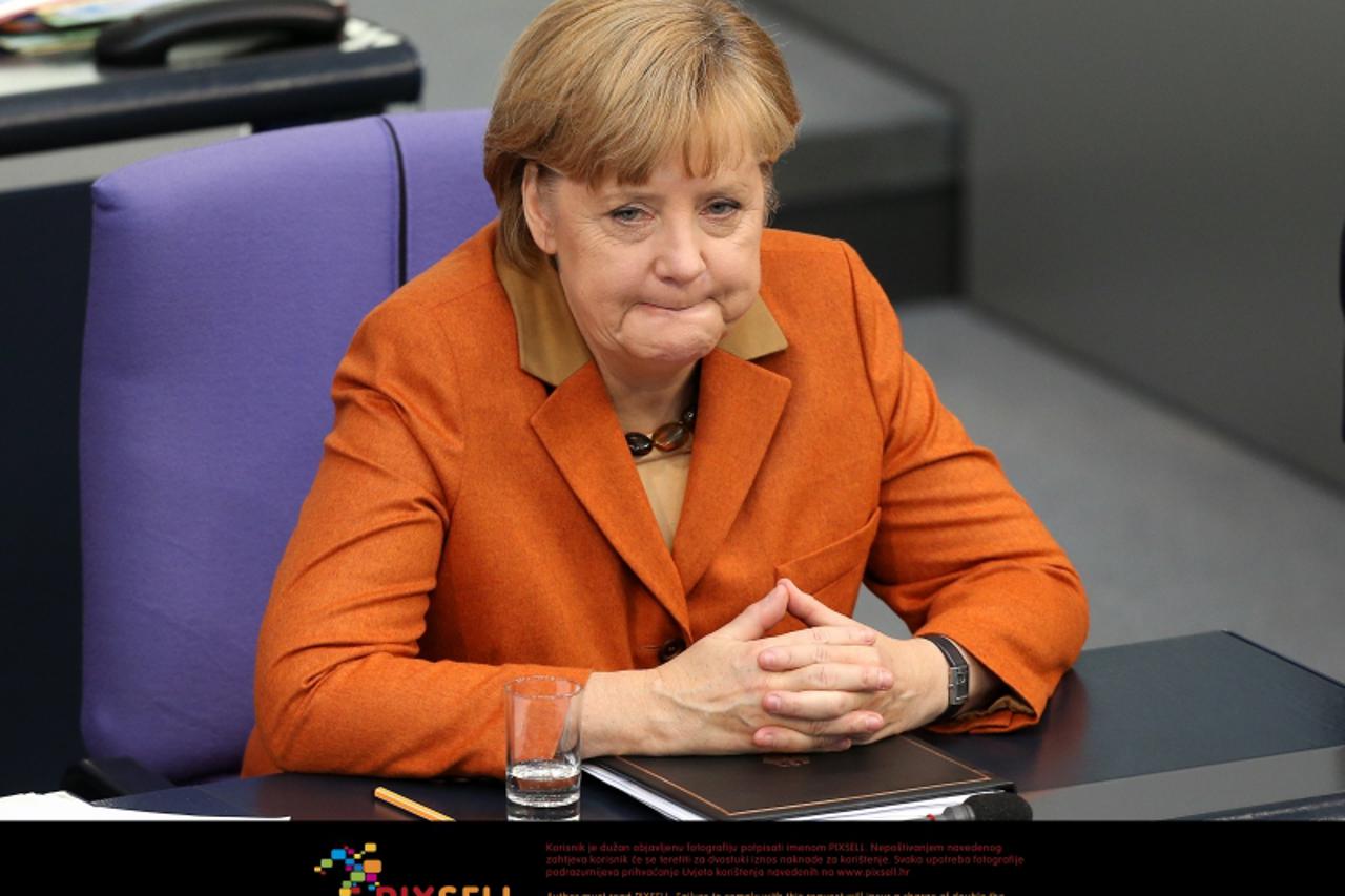 'German Chancellor Angela Merkel listens to debates at the Bundestag in Berlin, Germany, 18 October 2012. Photo: WOLFGANG KUMM/DPA/PIXSELL'