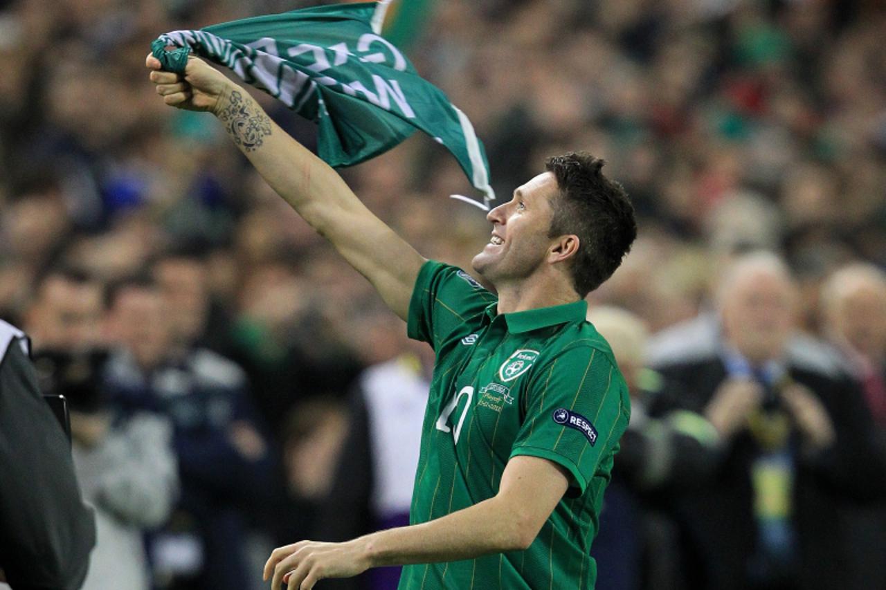 \'Republic of Ireland\'s Robbie Keane celebrates after defeating Estonia during the second leg a Euro 2012 play-offs at the Aviva Stadium in Dublin on November 15, 2011. The Republic of Ireland reache