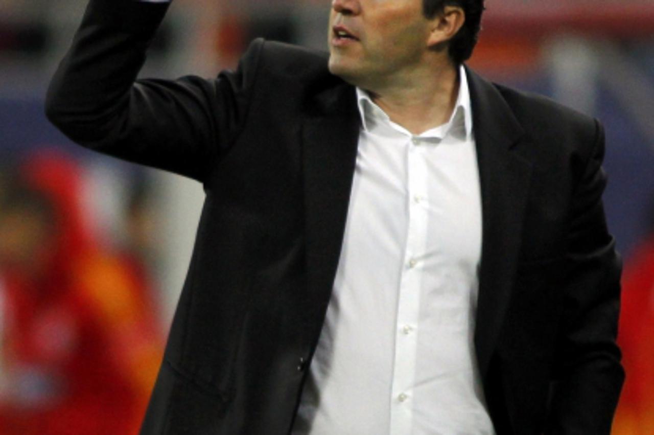 'Belgium\'s coach Marc Wilmots gestures to the players during their friendly soccer match against Romania at the National Arena in Bucharest November 14, 2012.  REUTERS/Bogdan Cristel (ROMANIA  - Tags