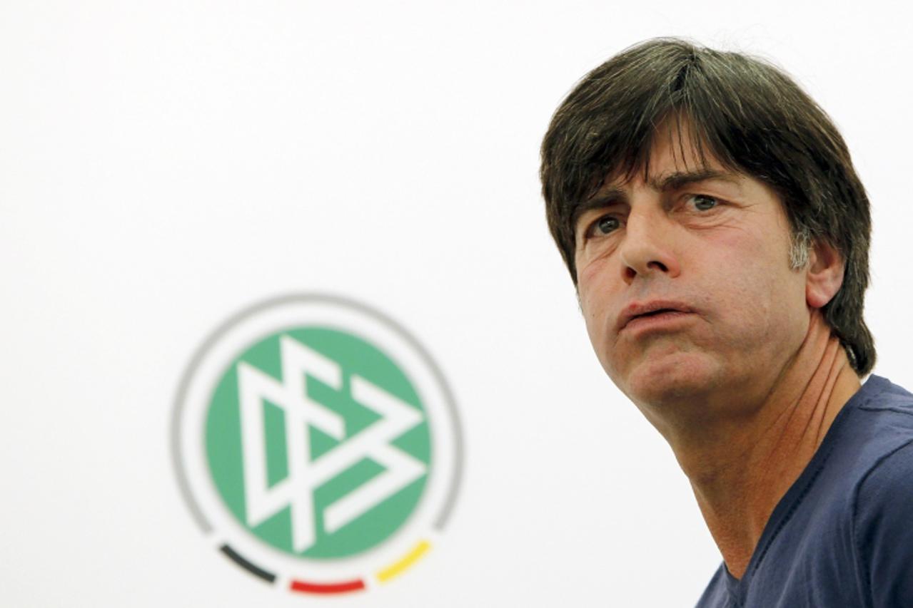 'Germany\'s national soccer coach Joachim Loew leaves after a news conference in Gdansk, June 19, 2012, ahead of their Euro 2012 match against Greece on June 22.          REUTERS/Thomas Bohlen (POLAND