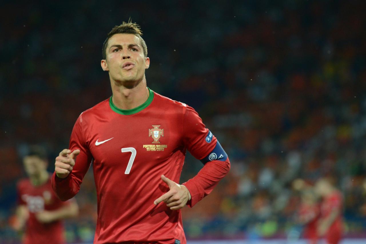 'Portuguese forward Cristiano Ronaldo celebrates after scoring during the Euro 2012 football championships match Portugal vs. Netherlands, on June 17, 2012 at the Metalist stadium in Kharkiv.       AF