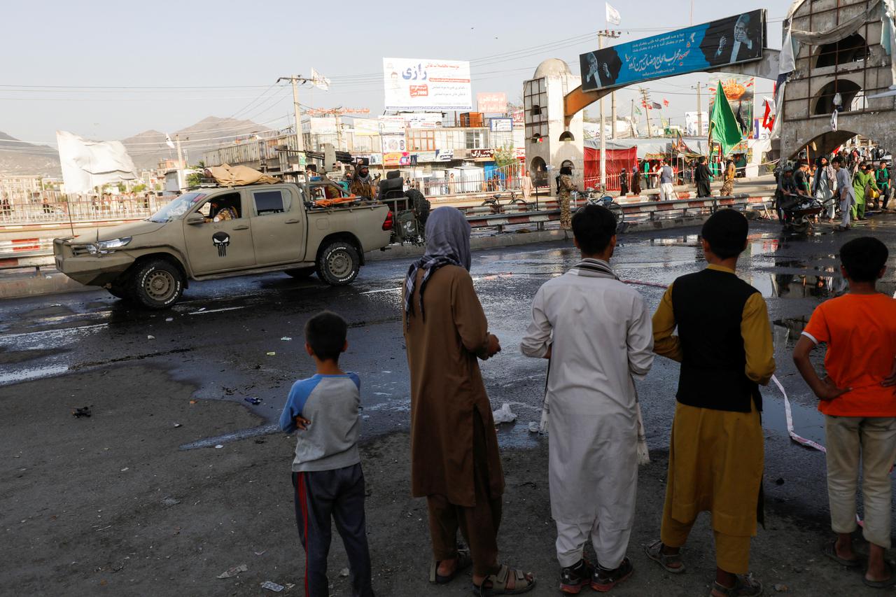 A Taliban car is seen guarding at the site of a blast in Kabul