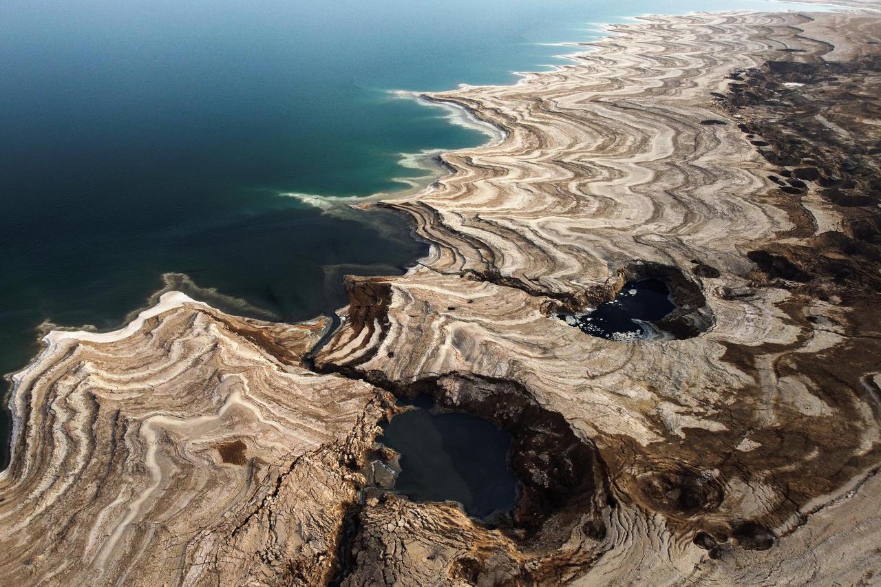 Sinkholes lay exposed near the shore of the Dead Sea near Ein Gedi