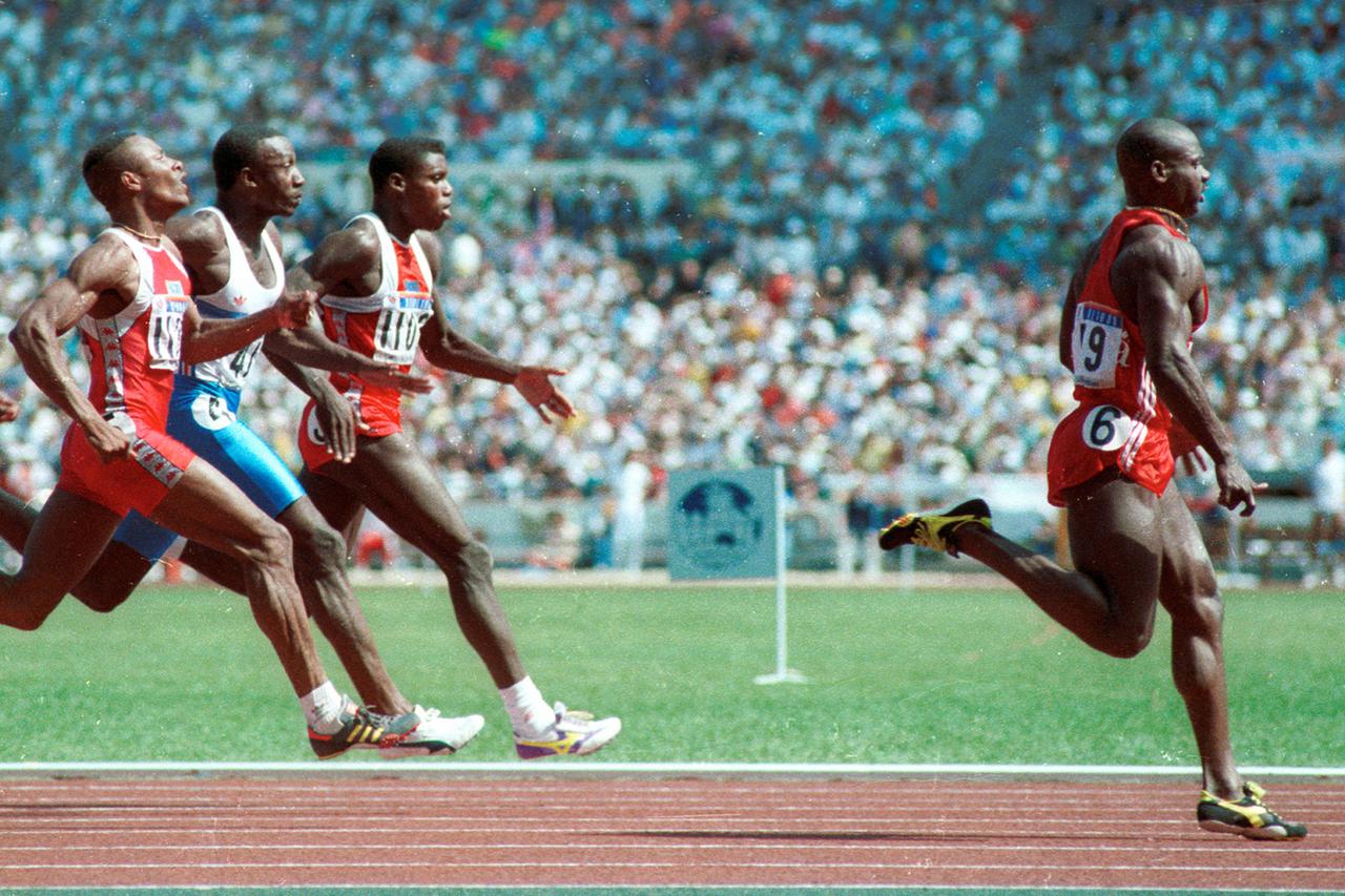 Sprinter Ben Johnson wins the gold medal in the 100m sprint in Seoul in September 1988. Behind him are Calvin Smith, Linford Christie and Carl Lewis. Johnson later lost the medal when he tested positive for steroids. REUTERS/Gary Hershorn  GMH/CMC Reuters