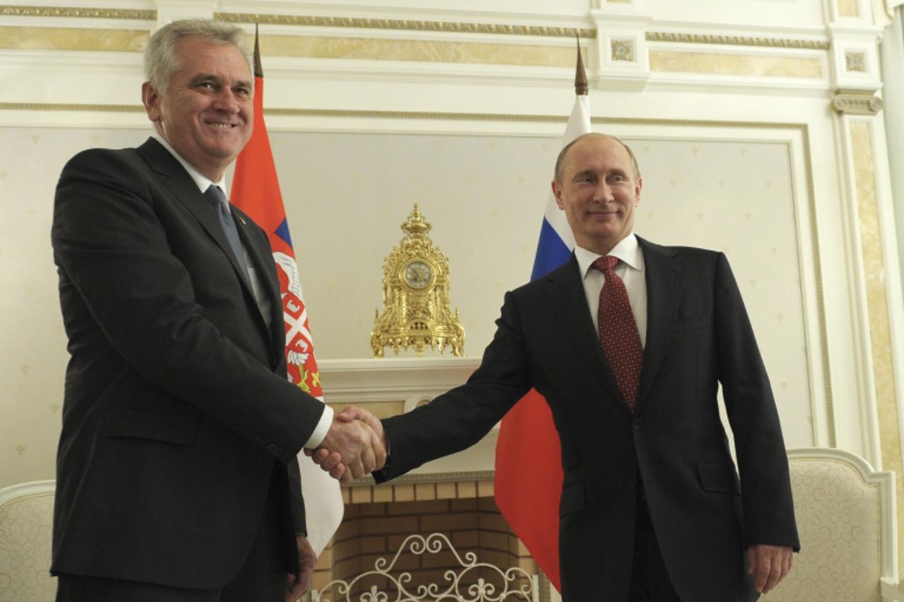 'Russian President Vladimir Putin (R) shakes hands with his Serbian counterpart Tomislav Nikolic during a meeting at the Bocharov Ruchei state residence in Sochi, September 11, 2012.  REUTERS/Alexsey 