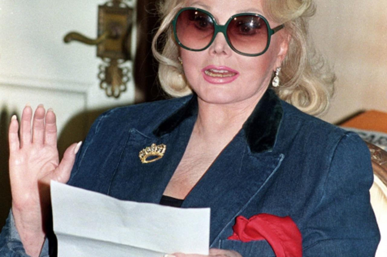 'Actress Zsa Zsa Gabor reads a statement at her home in Beverly Hills, concerning a federal court judgement of $3 million against her in this November 13, 1992 file photograph. Gabor, now in her 90s, 