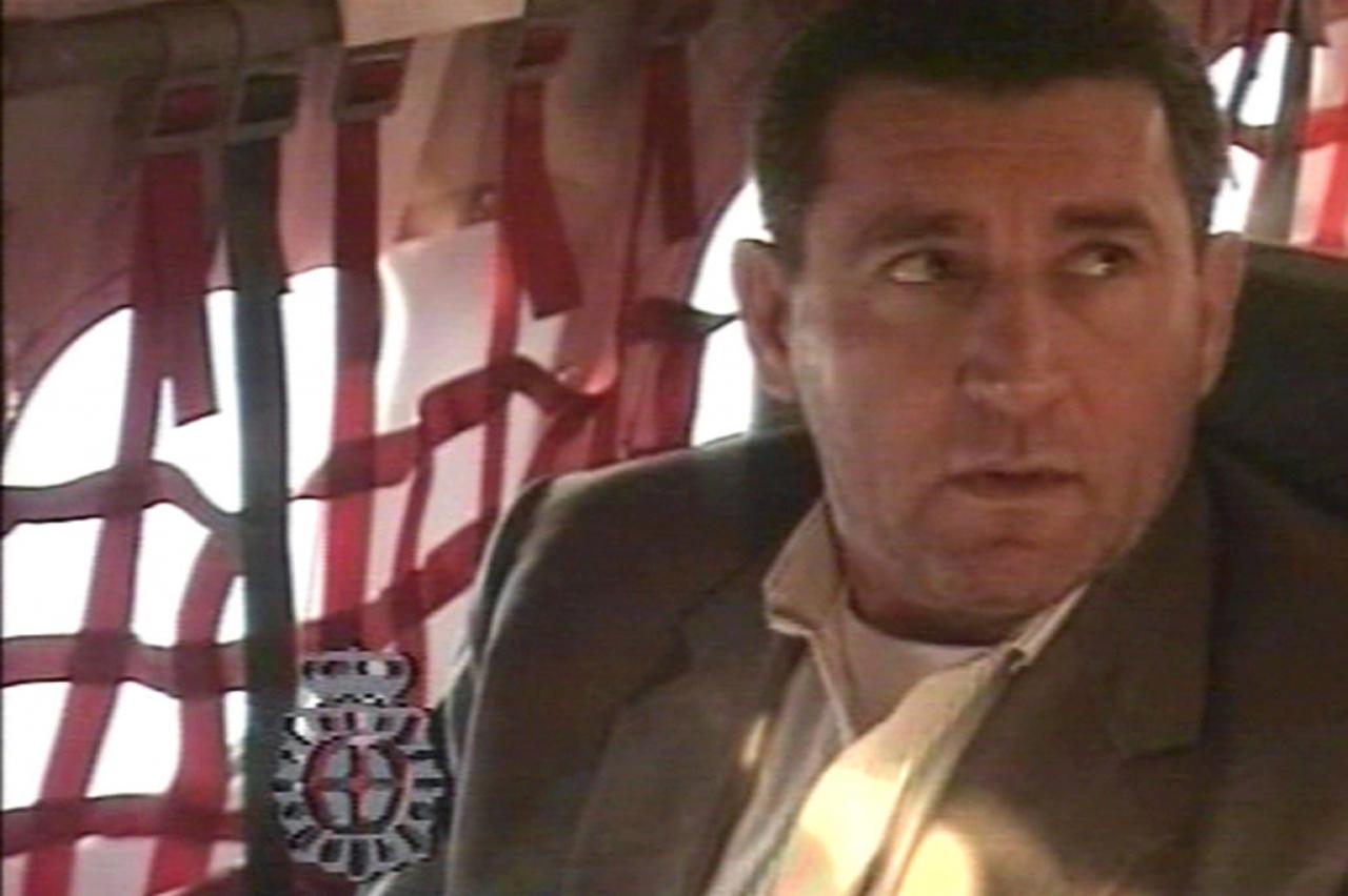 'TV grab from Euronews shows a video released by Spanish police of Croatian ex-general Ante Gotovina aboard an aircraft taking him to the Netherlands 10 December 2005. Gotovina, a top suspect from the