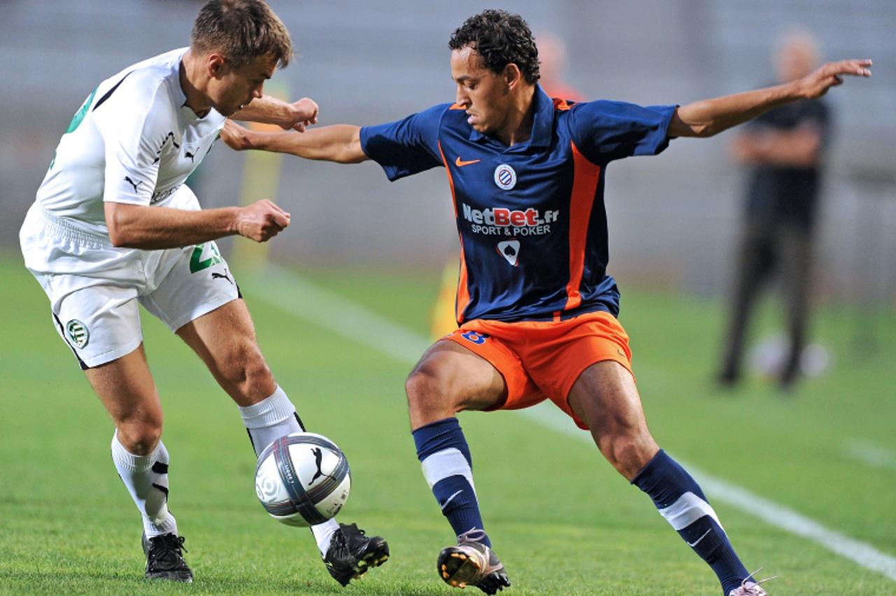 'Montpellier\'s forward Karim Aitfana (R) vies with Gyor\'s defender Babic Valentin (L) during their Europa league football match Montpellier versus Gyor on August 5, 2010 at the Mosson stadium in Mon