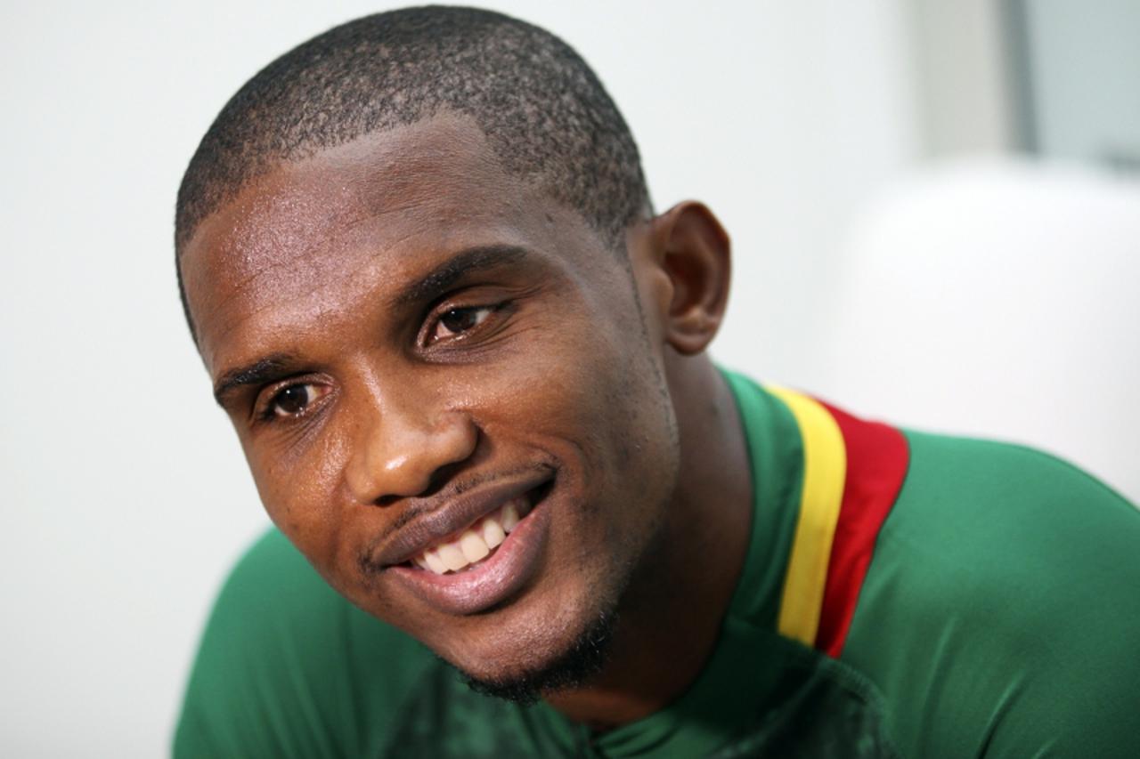 'Cameroon\'s Samuel Eto\'o smiles during an interview following the launch of Puma\'s kits for nine African national soccer teams at the Design Museum in London November 7, 2011.  REUTERS/Olivia Harri