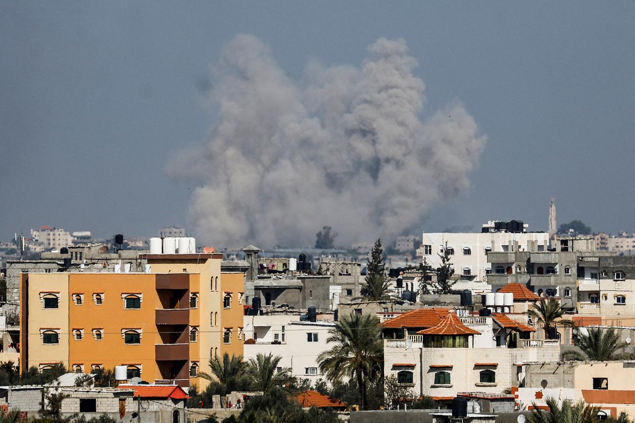 Smoke rises following Israeli strikes, amid the ongoing conflict between Israel and the Palestinian Islamist group Hamas, as seen from Rafah