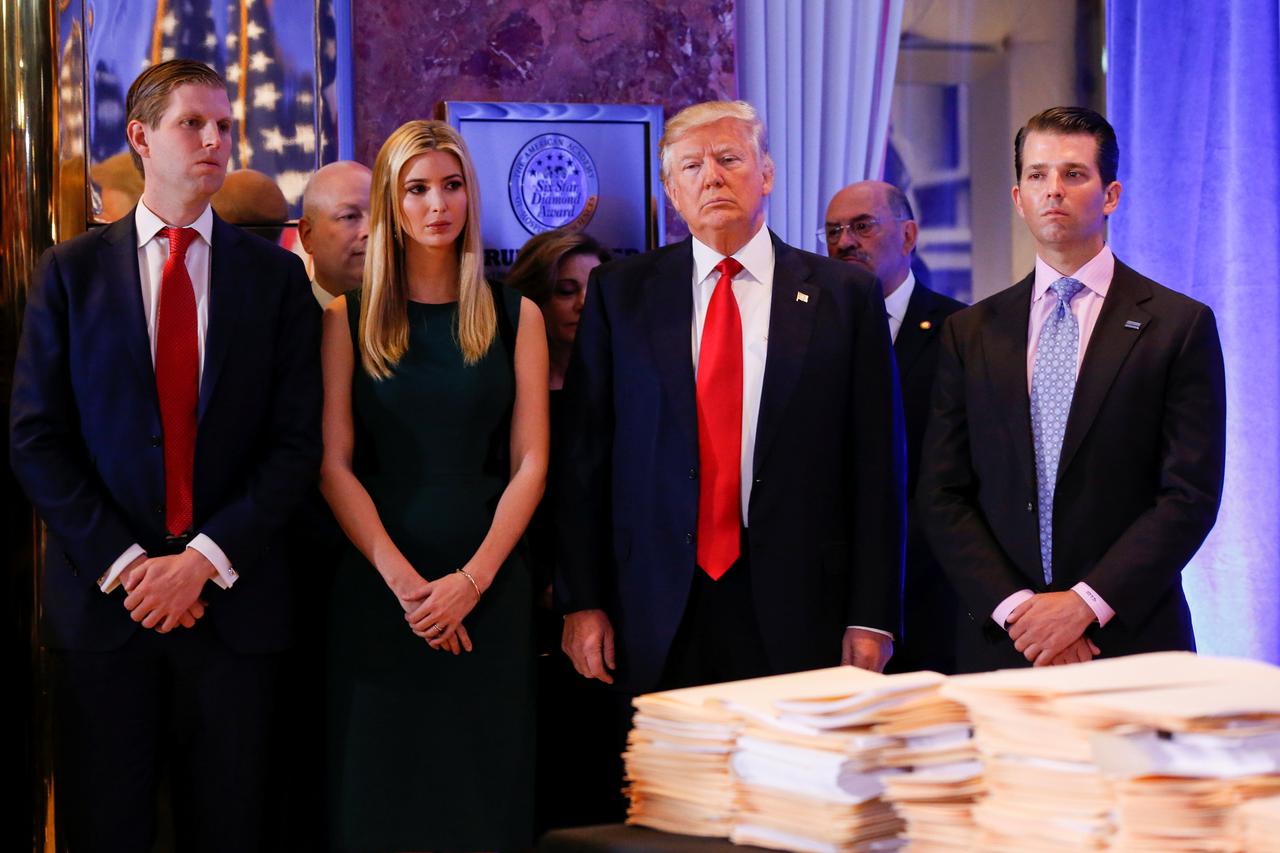 U.S. President-elect Donald Trump (C) stands surrounded by his son Eric Trump (L) daughter Ivanka and son in law Jared Kushner (R) ahead of a press conference in Trump Tower, Manhattan, New York, U.S., January 11, 2017. REUTERS/Shannon Stapleton     TPX I