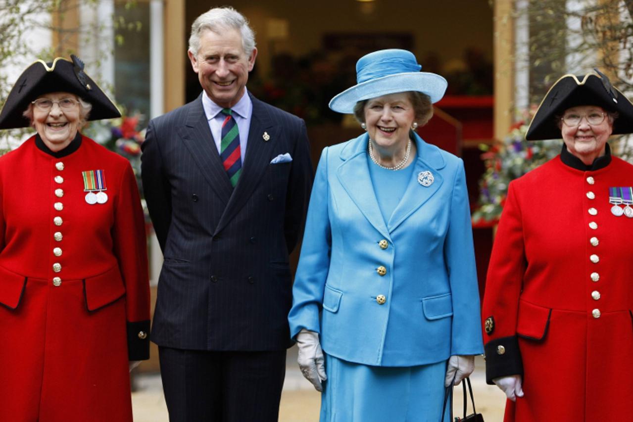 'Britain's Prince Charles (2nd L) and former Prime Minister Margaret Thatcher (2nd R) pose with Chelsea pensioners Dorothy Hughes (L) and Winifred Phillips as they attend the opening of a new infirma