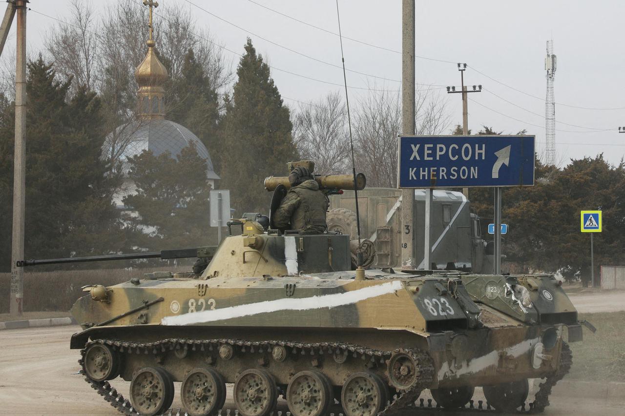 Russian Army military armoured vehicle drives along a street in Armyansk