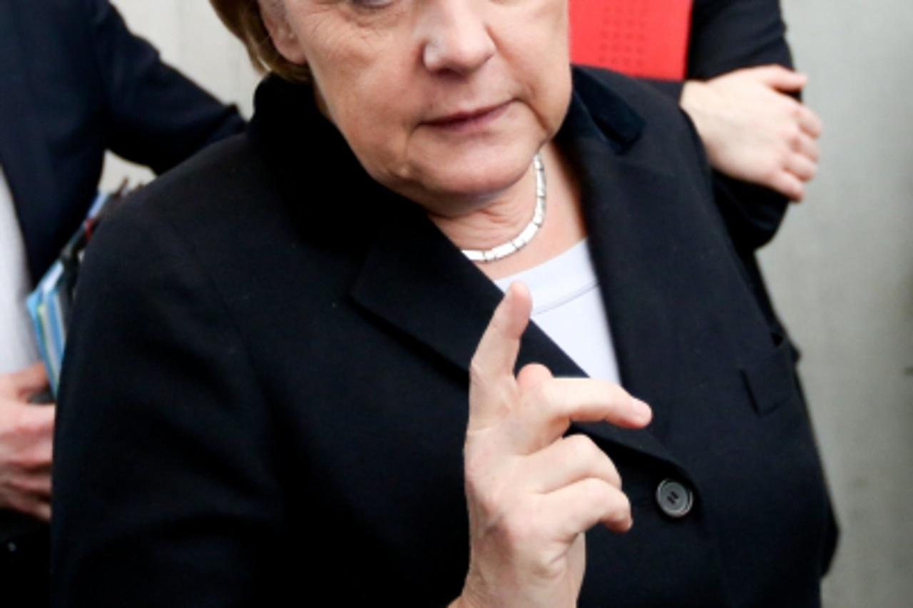 'German Chancellor Angela Merkel leaves the European Affairs Committee of the German Bundestag parliament at Paul Loebe House in Berlin, Germany, 20 March 2013. Photo: KAY NIETFELD/DPA/PIXSELL'