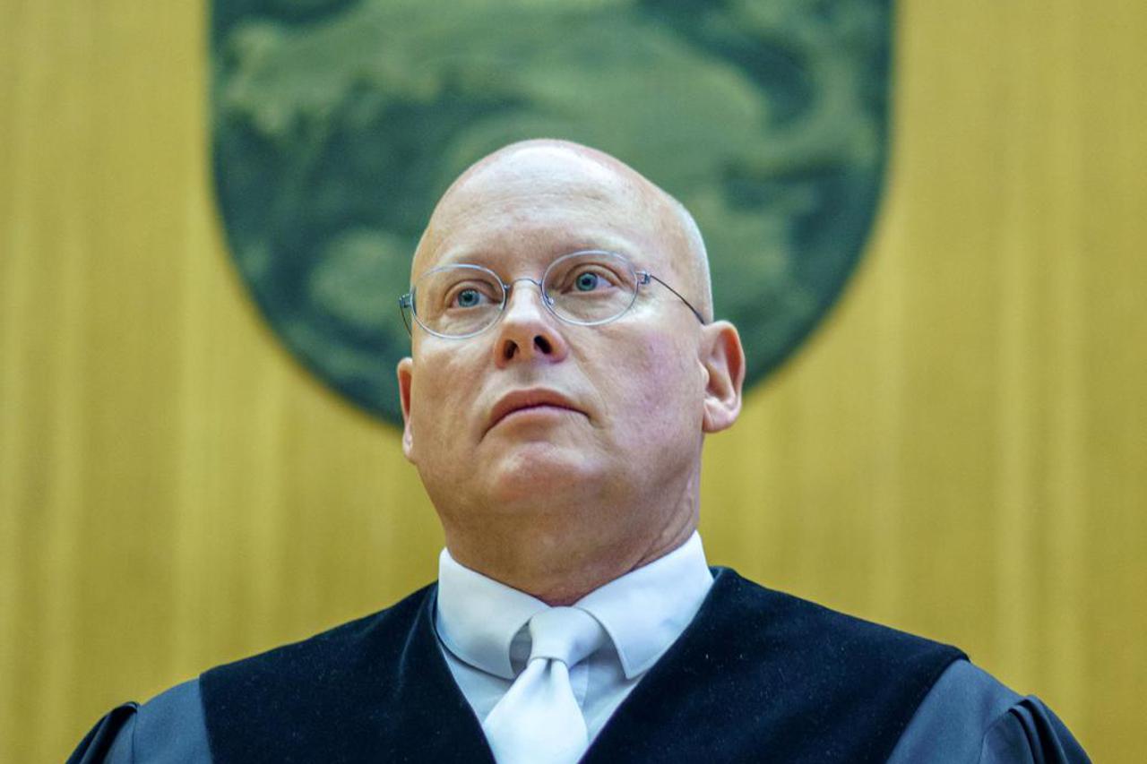 Judge Christoph Koller arrives before his verdict over Iraqi defendant Taha Al-J. in a courtroom in Frankfurt