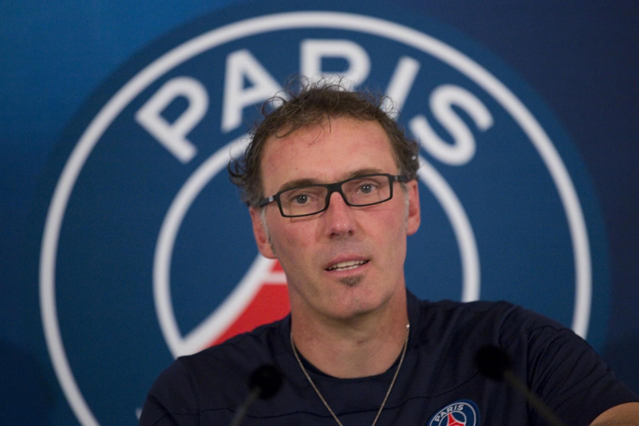 'Newly-named Paris St Germain soccer team coach Laurent Blanc attends a news conference after a training session at the French National Institute (INF) at Clairefontaine, near Paris, July 19, 2013.   