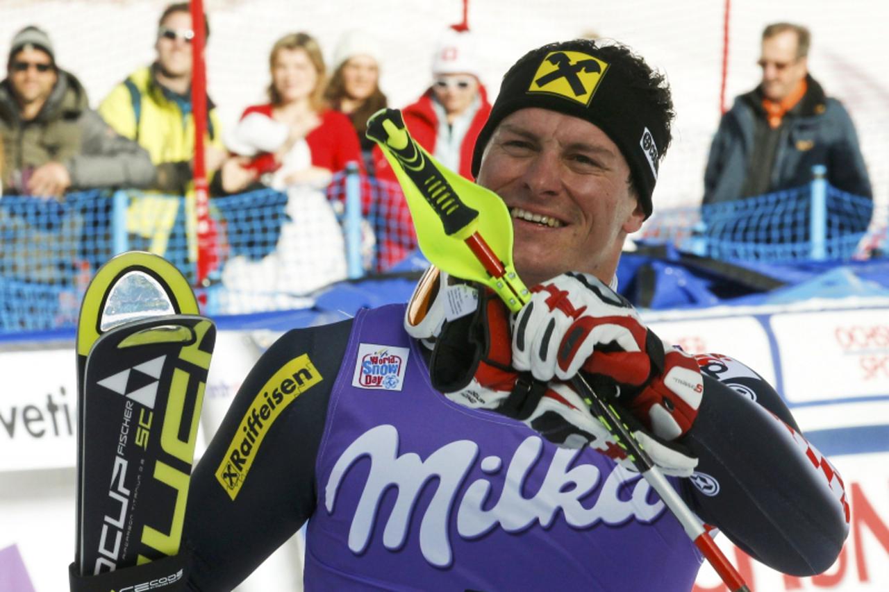 'Third placed Ivica Kostelic of Croatia reacts after the second run of the men\'s Alpine Skiing World Cup slalom race in Wengen January 20, 2013.                 REUTERS/Ruben Sprich (SWITZERLAND  - T