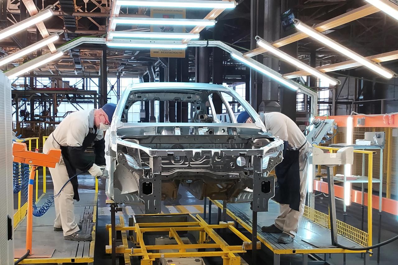 Employees work at the assembly line of the LADA Izhevsk automobile plant in Izhevsk