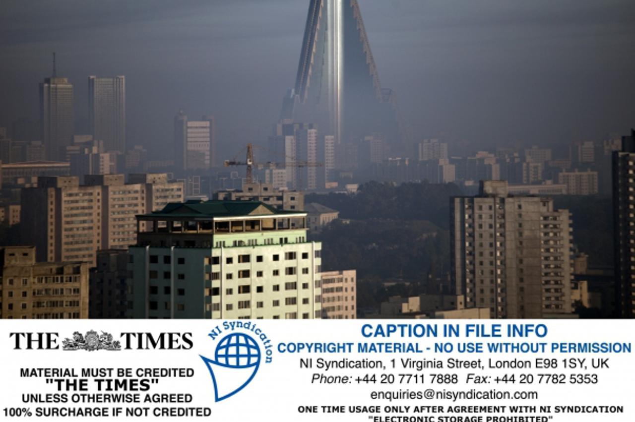 'The 105 story Ryugyong Hotel in Pyongyang. Construction began in 1987 and ceased in 1992, due to the government\'s financial difficulties. The unfinished hotel remained untouched until April 2008, wh