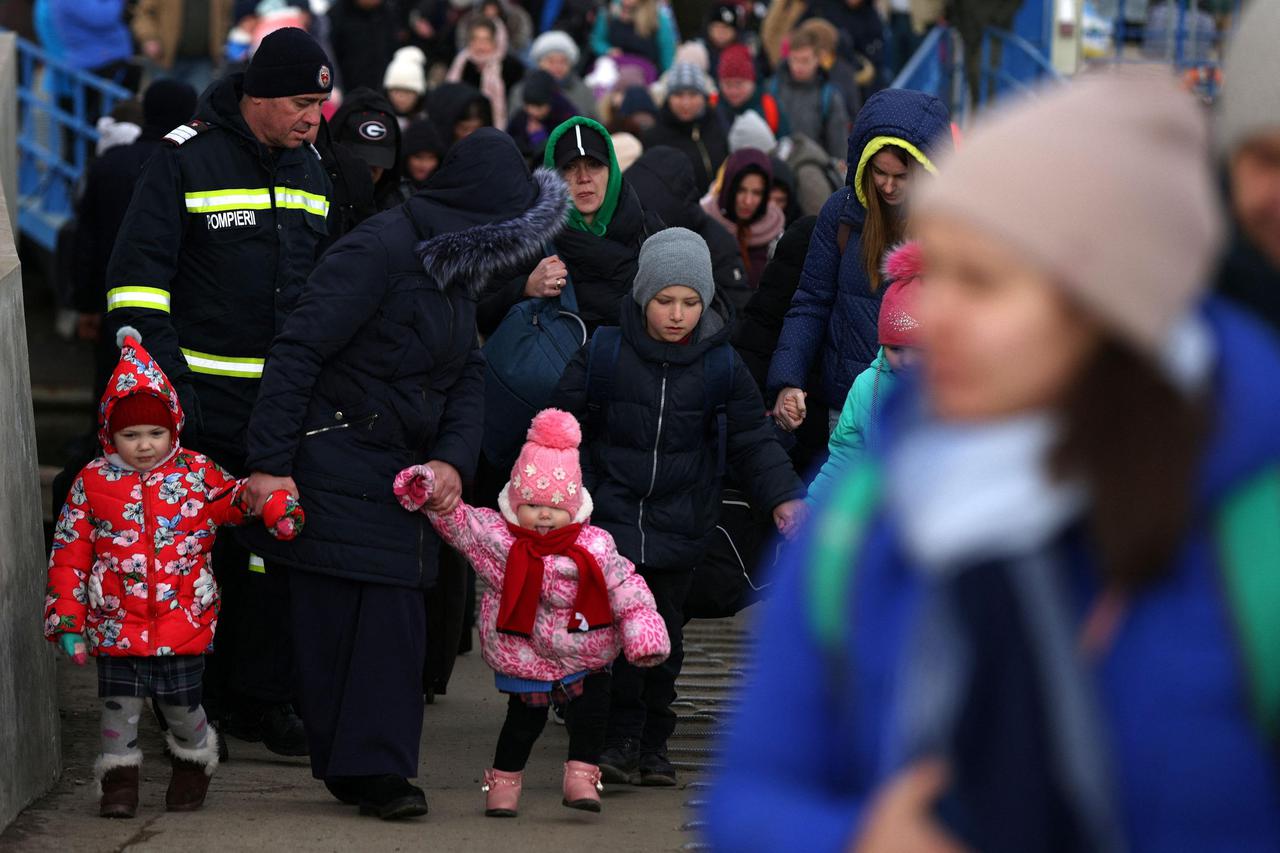 People flee from Ukraine to Romania at the border crossing in Isaccea