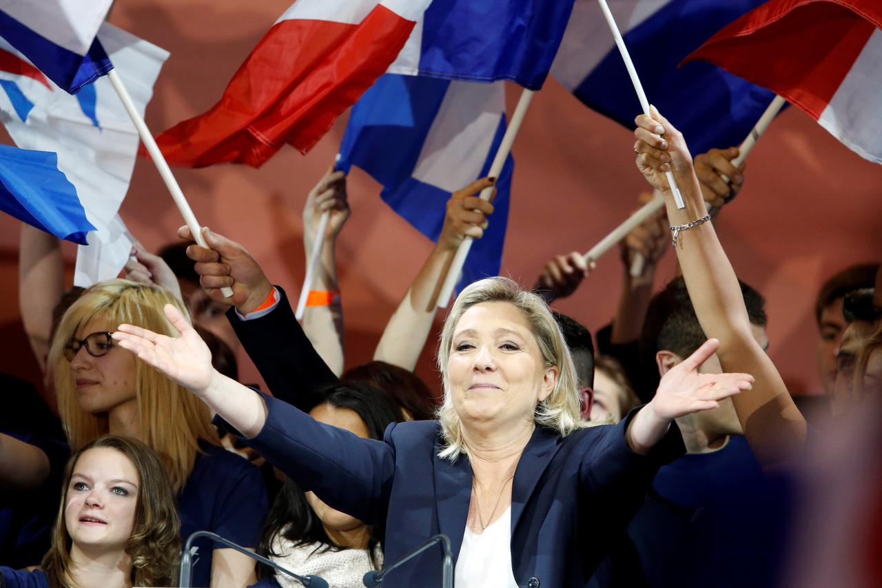 France's far right National Front political party leader Marine Le Pen reacts after delivering her speech as part of the National Front's annual May Day rally in Paris, France, May 1, 2016.   REUTERS/Charles Platiau