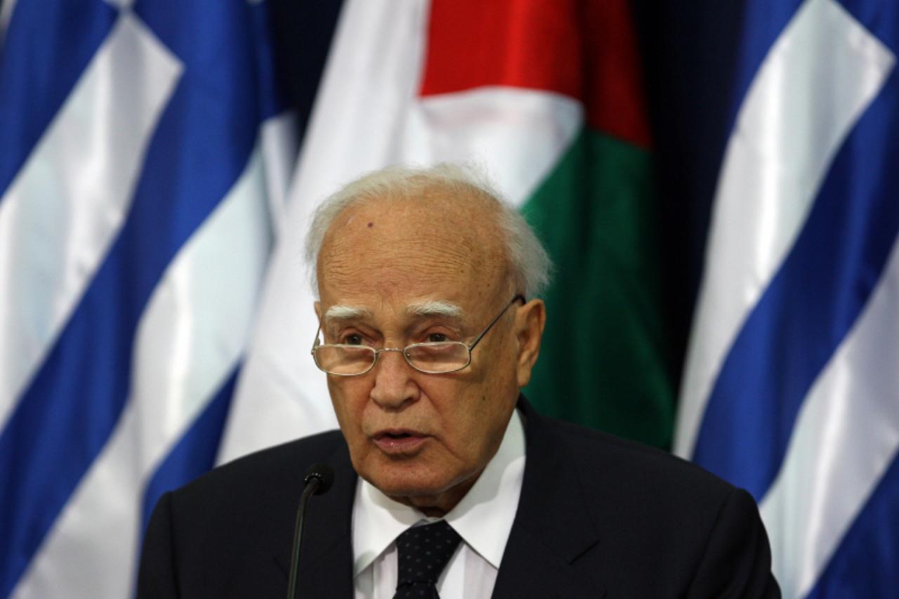 \'Greek President Karolos Papoulias speaks during a joint press conference with Palestinian president Mahmud Abbas (unseen) in the West Bank city of Ramallah on July 12, 2011 during an official visit 
