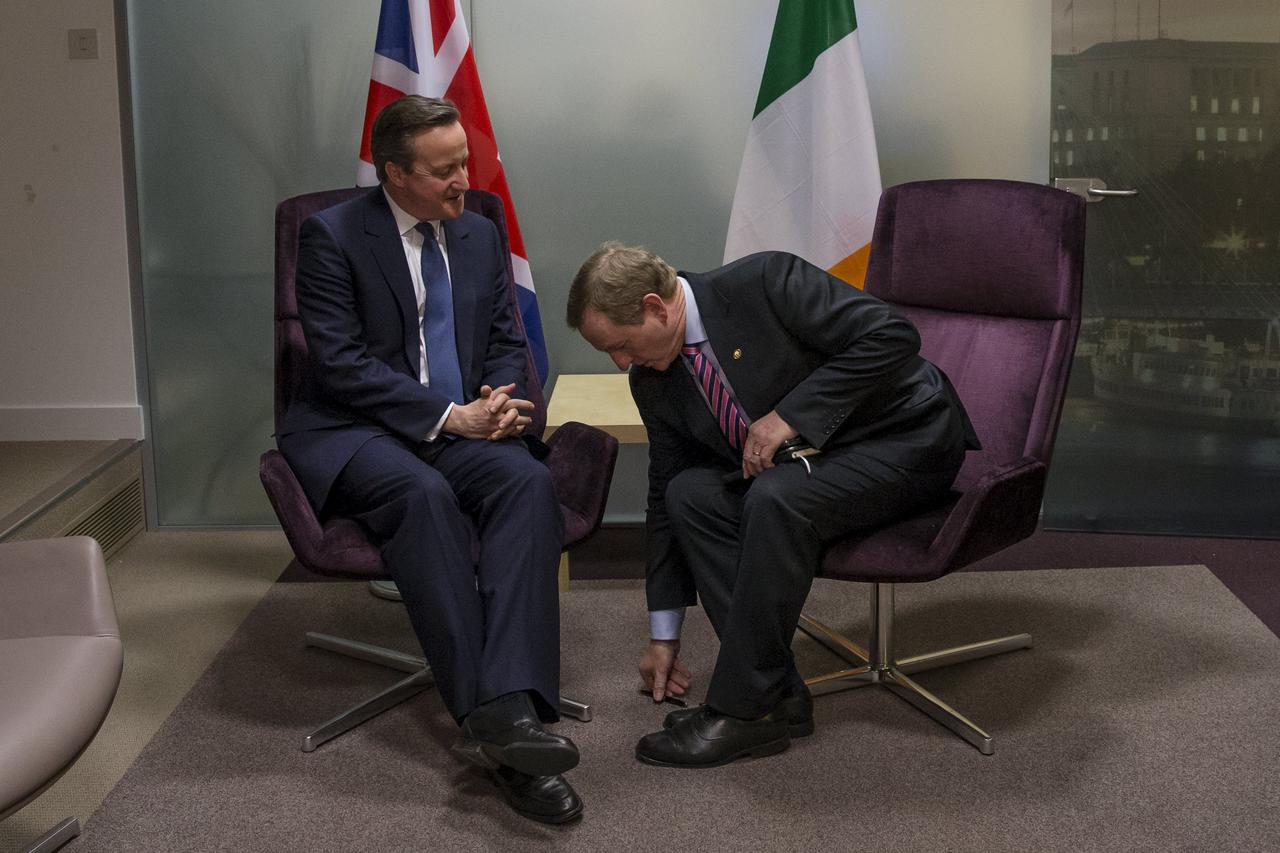 British Prime Minister David Cameron (L) attends a meeting with Irish Prime Minister Enda Kenny (R) during a European Union leaders summit addressing the talks about the so-called Brexit and the migrants crisis, in Brussels, Belgium, February 19, 2016. RE