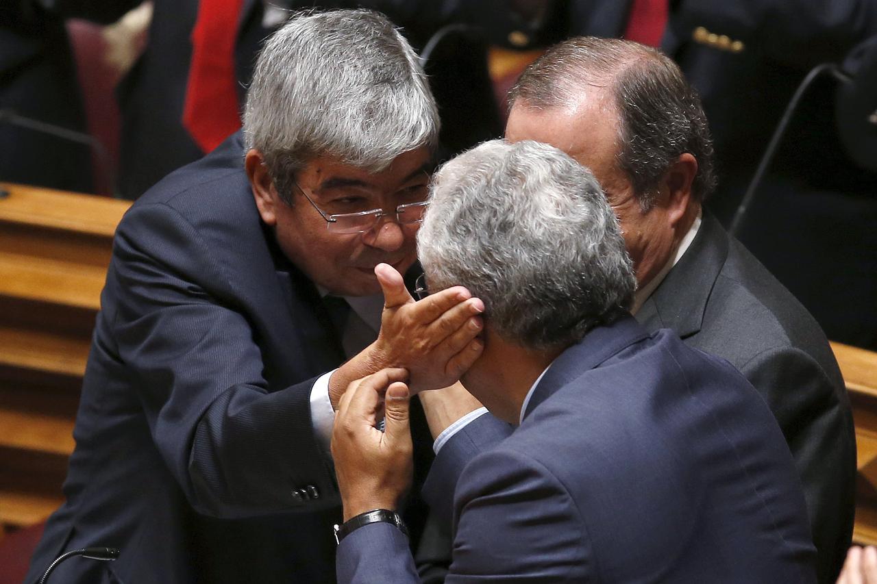 Eduardo Ferro Rodrigues (L) of Socialist Party is congratulated by his leader Antonio Costa (R), after his election as Portuguese Parliament President in Lisbon, Portugal, October 23, 2015. Portugal's opposition Socialists pledged on Friday to topple the 