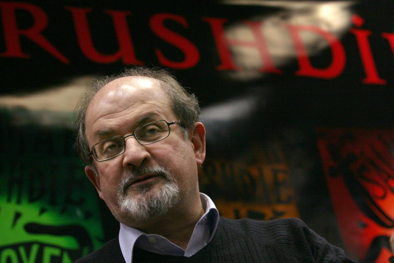 '(FILES) -  A file picture shows Indian-born British author Salman Rushdie arriving to dedicate his book in Hungarian language ay the Libri bookshop of Mammut Plaza in Budapest, 29 November 2007. Brit