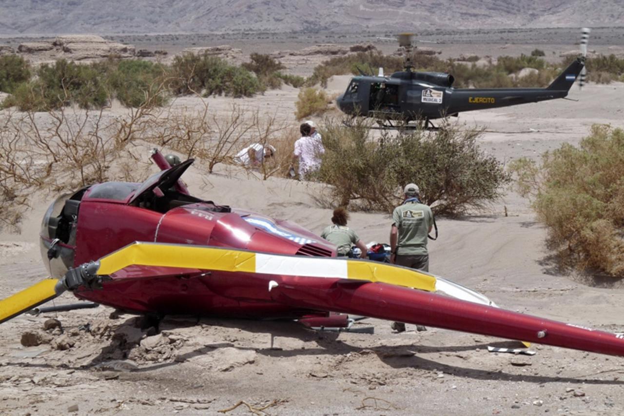 'Picture of a helicopter that fell near Fiambala, in the Argentine province of Catamarca on January 4, 2009 during the third stage of the 2010 Dakar Rally. Four people - including two TV journalists -