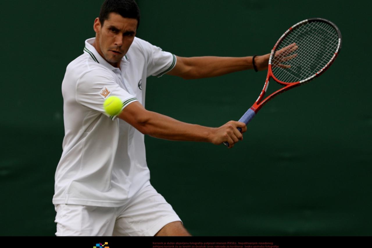'Romania\'s Victor Hanescu in action against Germany\'s Daniel Brands Photo: Press Association/Pixsell'