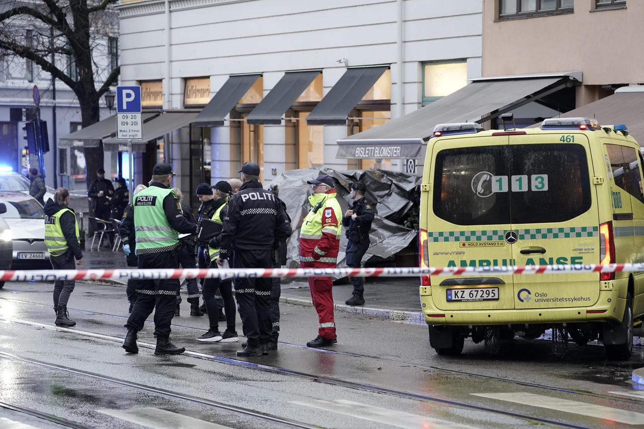Police members stand at a site where shots were fired in Bislett area in Oslo