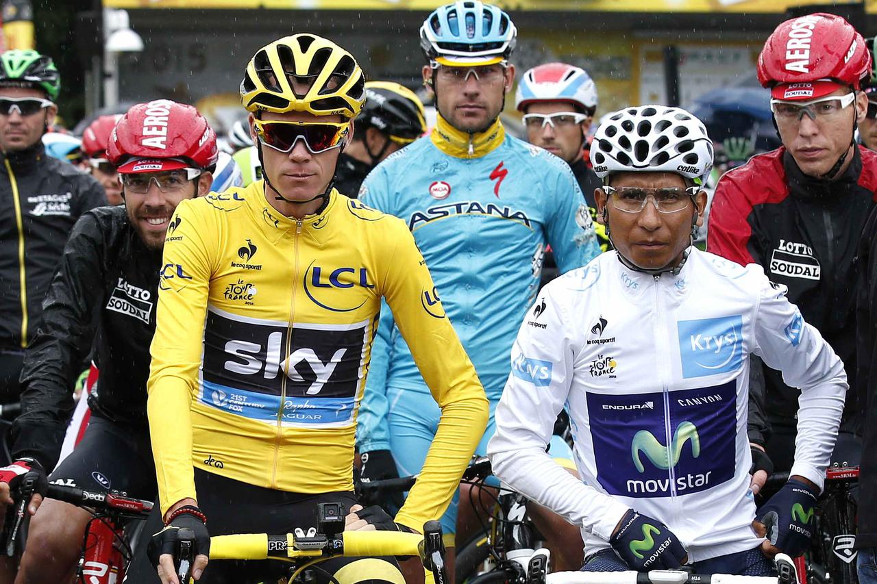 Team Sky rider Chris Froome of Britain (L), race leader's yellow jersey, and Movistar rider Nairo Quintana of Colombia (R) wait for the start of the 109.5-km (68 miles) final 21st stage of the 102nd Tour de France cycling race from Sevres to Paris Champs-
