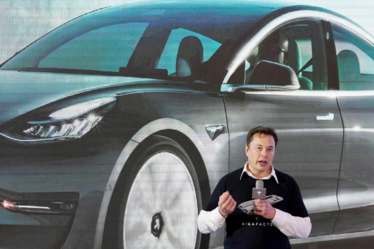 FILE PHOTO: FILE PHOTO: Tesla Inc CEO Elon Musk speaks onstage during a delivery event for Tesla China-made Model 3 cars at its factory in Shanghai