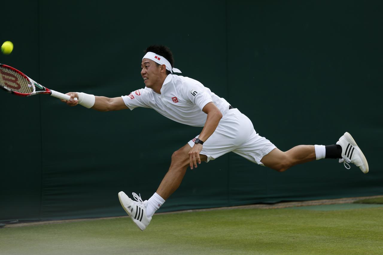Tennis - 2014 Wimbledon Championships - Day Two - The All England Lawn Tennis and Croquet ClubJapan's Kei Nishikori in his match against France's Kenny De SchepperEMPICS Sport Photo: Press Association/PIXSELL