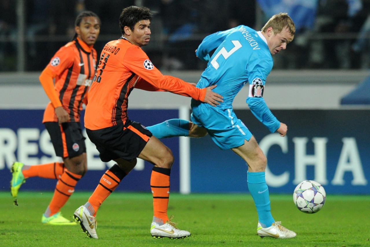 'Aleksandr Anyukov (L) of FC Zenit St Petersburg  fights for the ball against Eduardo of FC Shakhtarduring their UEFA Champions League, Group G football match in Saint-Petersburg on November 1, 2011. 