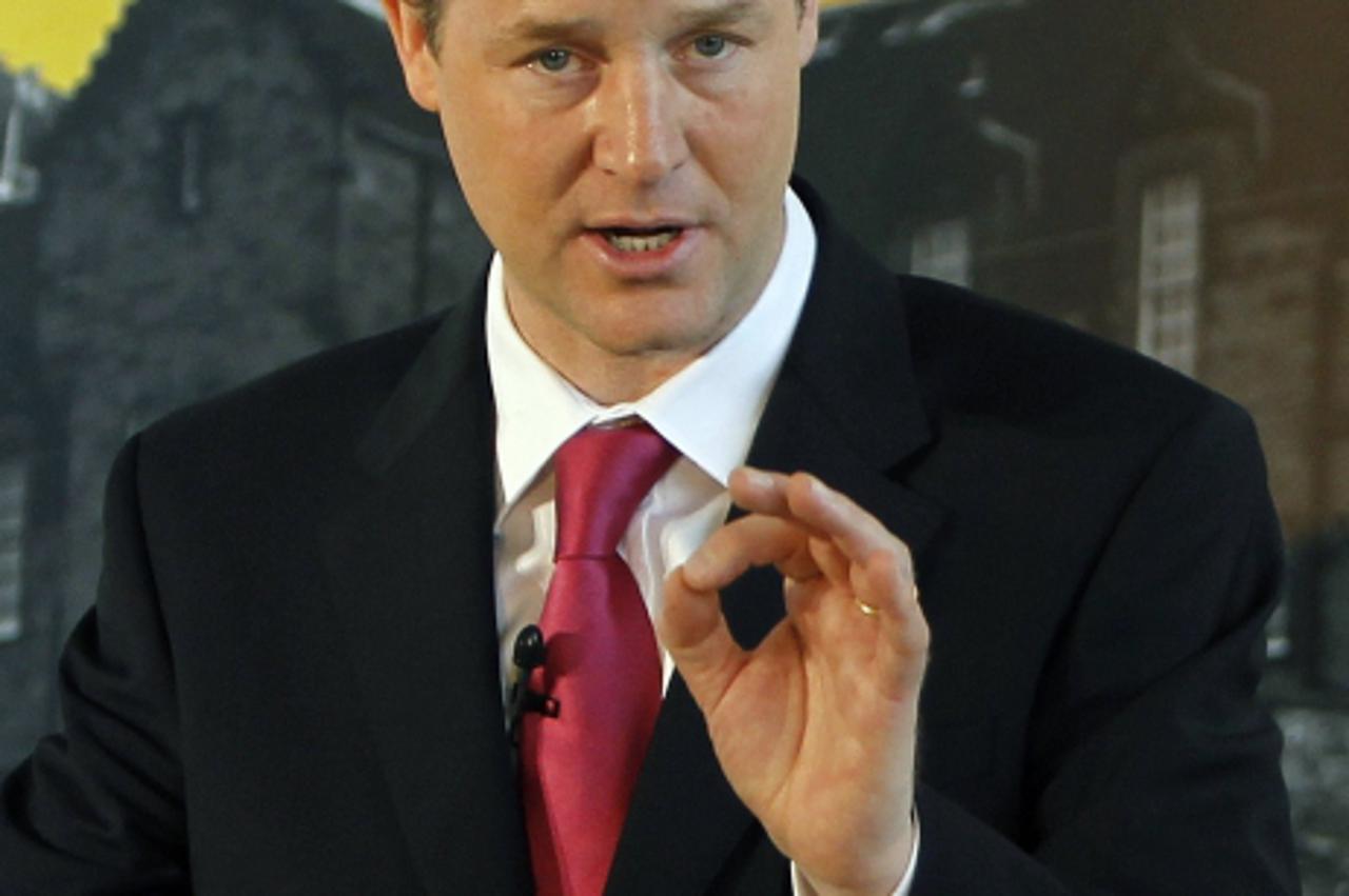 'Britain\'s Liberal Democrat leader, Nick Clegg, gestures as he speaks at a news conference in Edinburgh, Scotland April 26, 2010. REUTERS/David Moir (BRITAIN - Tags: POLITICS ELECTIONS)'