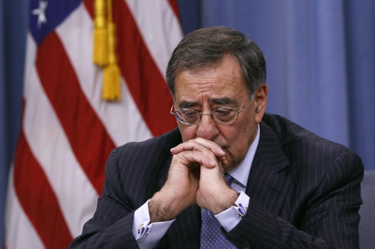 'U.S. Defense Secretary Leon Panetta looks down during a media briefing at the Pentagon in Washington, DC  January 26, 2012.  The Pentagon unveiled budget cuts on Thursday that would slash the size of