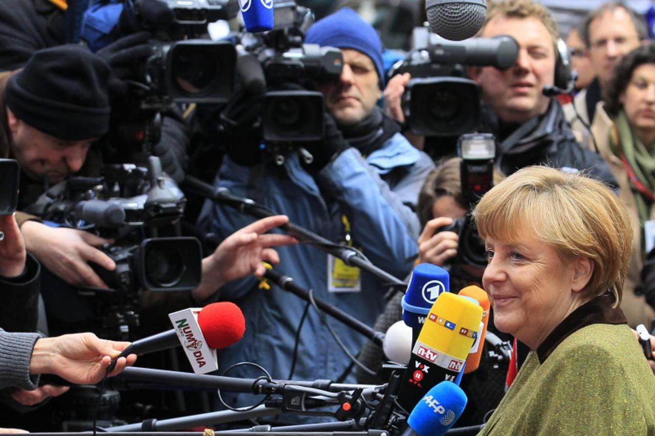 'Germany's Chancellor Angela Merkel arrives at the EU council headquarters for an European Union leaders summit meeting to discuss the European Union's long-term budget in Brussels February 7, 2013.