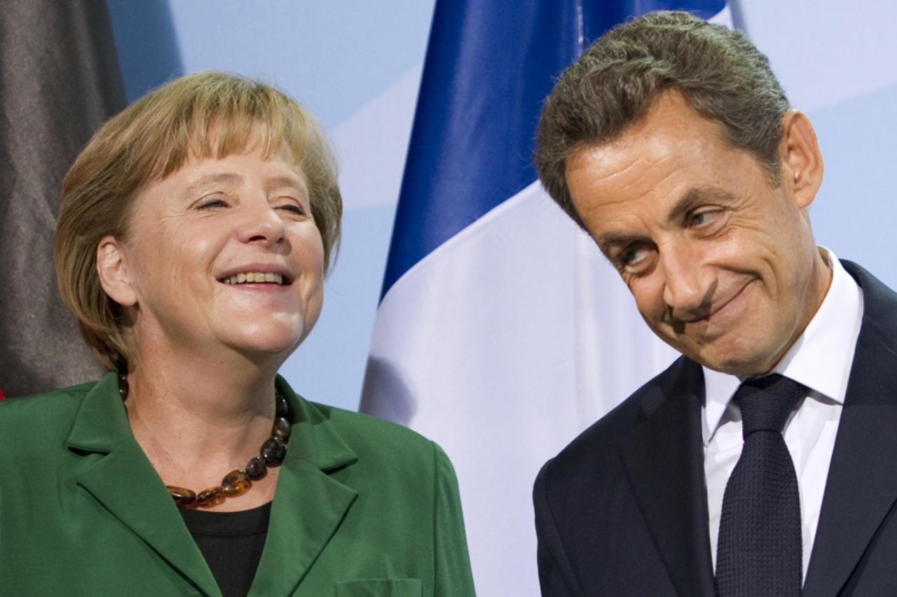 '(FILES) Photo taken on October 9, 2011 at the Chancellery in Berlin showing German Chancellor Angela Merkel and French President Nicolas Sarkozy. The leaders of France and Germany will meet the head 