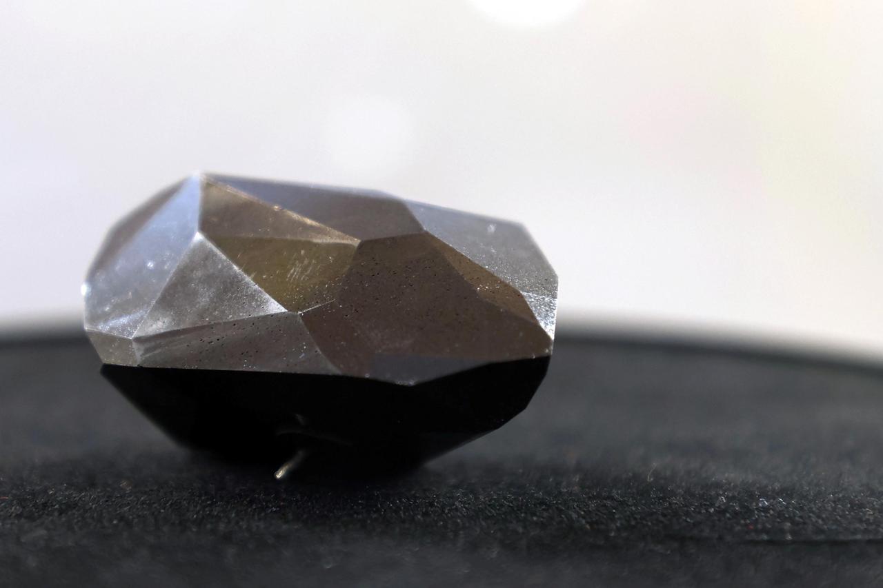 A 555.55 carat black diamond named The Enigma is pictured before being auctioned at Sotheby's in Beverly Hills